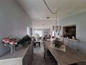 Inviting dining room with view into the living room, great for entertaining at 3835 Sailmaker Ln # X, Holiday, FL 34691