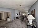 Comfortable living room offering versatile space for relaxation and entertainment at 3835 Sailmaker Ln # X, Holiday, FL 34691