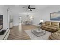 Bright living room showcasing a modern sofa, stylish decor, and an open dining area, creating an inviting space at 5095 Bay Ne St # 210, St Petersburg, FL 33703