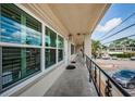 Inviting entryway featuring a well-lit walkway, sleek railing, and covered porch at 5694 40Th N Ter # 423, Kenneth City, FL 33709