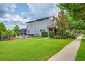 Expansive backyard featuring a well-maintained lawn and a fenced-in pool area, perfect for outdoor enjoyment at 5724 Shell Ridge Dr, Lithia, FL 33547