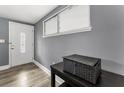 Inviting entryway featuring a decorative front door, stylish flooring and neutral gray walls at 629 Lexington St, Dunedin, FL 34698