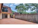 Private backyard with stained concrete and wood fence at 714 1St Ct, Palm Harbor, FL 34684
