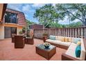 Relaxing outdoor patio features a comfortable seating area with elegant wicker furniture at 714 1St Ct, Palm Harbor, FL 34684