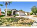 Inviting single-Gathering home with lush landscaping and a spacious driveway, bathed in sunlight at 8736 Huntfield St, Tampa, FL 33635