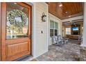 Welcoming front porch featuring comfortable seating, a wood-paneled ceiling, and a view of the outdoors at 911 S Sterling Ave, Tampa, FL 33629