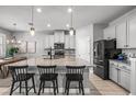 Stylish kitchen features a large island with granite countertops and modern appliances at 11322 Lake Lucaya Dr, Riverview, FL 33579