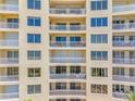 Condo exterior showcasing multiple floors, private balconies, and abundant natural light at 1200 Gulf Blvd # 404, Clearwater Beach, FL 33767
