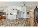 Open-concept living room with modern decor, wood flooring, and an airy design, perfect for entertaining at 1758 Biarritz Cir, Tarpon Springs, FL 34689