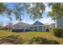 Charming home with covered porch, inviting outdoor space at 2009 153Rd E Ct, Bradenton, FL 34212