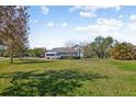Spacious lawn featuring a two-story home with large windows at 2009 153Rd E Ct, Bradenton, FL 34212