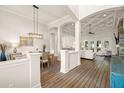 Open-concept space featuring coffered ceilings, an elegant dining area, and lots of natural light at 2142 Scarlet Oaks St, Clearwater, FL 33759