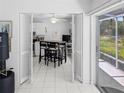 Bright kitchen featuring white cabinets, modern appliances, and breakfast bar for casual dining at 2413 Oxford Down Ct # 58, Sun City Center, FL 33573