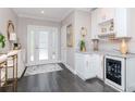 Stylish entryway features hardwood floors, recessed lights, wine storage, and an adjoining bar area at 2807 W Hawthorne Rd # 11, Tampa, FL 33611