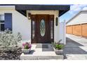 Elegant front door with decorative glass, set within a charming home exterior, number plaque visible at 3315 W Pearl Ave, Tampa, FL 33611