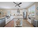 Modern kitchen with stainless steel appliances, granite countertops, and island at 3543 Gamble St, New Port Richey, FL 34655