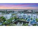 Panoramic aerial view showcasing waterfront property with multiple homes, boat docks, and serene water views at 4357 Marina View Way, Cortez, FL 34215
