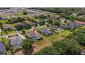 Spacious residence features a screened-in pool, extensive backyard, and is surrounded by beautiful landscaping and lush greenery at 5507 Keeler Oak St, Lithia, FL 33547