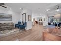 Open-concept living room with hardwood floors and a view of the backyard and pool at 5507 Keeler Oak St, Lithia, FL 33547