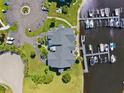 Aerial view of condo community with boat docks, parking, and waterfront access at 5712 Biscayne Ct # 103, New Port Richey, FL 34652