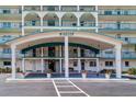 Beautiful entrance to Windsor building, with covered parking, walkway, and well manicured plants at 6020 Shore S Blvd # 503, Gulfport, FL 33707