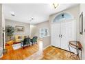 Bright foyer featuring tile flooring, a double-door entryway, and view into the adjacent living space at 9535 Norchester Cir, Tampa, FL 33647