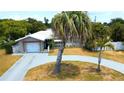 Aerial view of a charming single-story home with a well-maintained lawn and inviting curb appeal at 101 S Maywood Ave, Clearwater, FL 33765