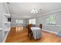 Bright, open-concept living and dining area with gleaming hardwood floors and ample natural light at 11200 102Nd Ave # 62, Seminole, FL 33778