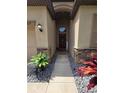 Inviting front entrance with a decorated front door and a stone and stucco exterior finish at 11617 Brighton Knoll Loop, Riverview, FL 33579