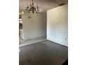 Spacious living room featuring neutral paint ready for customization with adjacent dining area at 1204 W Alsobrook St, Plant City, FL 33563