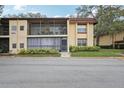 Charming condo showcasing dual balconies and well-maintained landscaping at 14107 Mossy Glen Ln # 203, Tampa, FL 33613