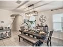 Elegant dining room with stylish lighting and ample seating for gatherings at 17012 Oval Rum Dr, Wimauma, FL 33598