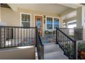Cozy front porch with colorful rug, comfortable chairs, and a welcoming ambiance at 1813 Hillside Dr, Tampa, FL 33610