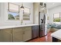 Bright kitchen featuring stainless steel appliances, light countertops, and a breakfast nook at 241 72Nd N St, St Petersburg, FL 33710
