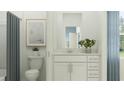 A stylish bathroom with a neutral color scheme, featuring a modern vanity, toilet, and decorative artwork at 3481 Lapis Lake Dr, Zephyrhills, FL 33541