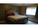 Cozy bedroom with carpet floors and a comfortable queen size bed at 3914 Roswell Pl, Land O Lakes, FL 34639