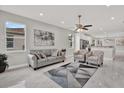 Bright living room with neutral paint, tiled floor, modern furnishings and ample natural light at 4071 45Th N Ave, St Petersburg, FL 33714
