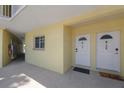 Condo exterior featuring entry doors with access to unit 107 and 108 at 4103 Gulf Blvd # 107, St Pete Beach, FL 33706