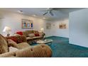 Cozy living room featuring comfortable seating and a bright, airy ambiance at 6421 Wilshire Dr, Tampa, FL 33615