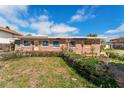 View of the front of the single story home showing front yard at 7075 Sunset S Dr, South Pasadena, FL 33707