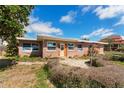 View of the front of the home and walkway at 7075 Sunset S Dr, South Pasadena, FL 33707