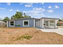 Charming single-story home with a unique gated entrance and cozy front yard at 8006 Tanglewood Ln, Tampa, FL 33615