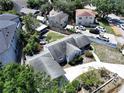 A residential neighborhood with a charming single-Gathering home nestled among mature trees at 116 S Arrawana Ave, Tampa, FL 33609