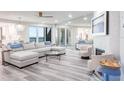Bright living room featuring modern furniture, stylish decor, and floor-to-ceiling mirrors at 1600 Gulf Blvd # 1112, Clearwater Beach, FL 33767