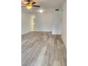 Spacious living room featuring modern flooring, ceiling fan and neutral paint at 2293 Swedish Dr # 11, Clearwater, FL 33763