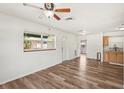 Open-concept living area with modern wood-look flooring and abundant natural light at 307 Francis Dr, Apollo Beach, FL 33572