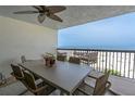 Relaxing balcony with outdoor seating provides breathtaking ocean views, perfect for enjoying seaside living at 3200 Gulf Blvd # 202, St Pete Beach, FL 33706