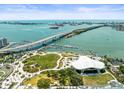 Scenic aerial view of waterfront with marina, bridge, and lush green spaces near the condo and the surrounding area at 331 Cleveland St # 906, Clearwater, FL 33755