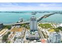 Panoramic aerial shot displaying a modern condo, waterfront access, and a swimming pool amenity on top of the building at 331 Cleveland St # 906, Clearwater, FL 33755