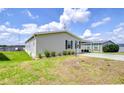 A well-maintained single Gathering home featuring verdant lawn and spacious driveway at 37642 Landis Ave, Zephyrhills, FL 33541